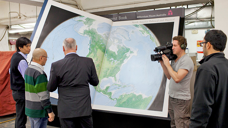 Illustration for article titled World's Largest Atlas Needs Two People To Turn Each Page